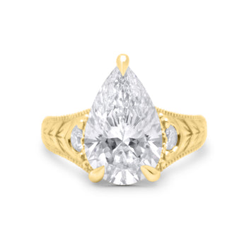 Gabby | Pear cut Moissanite Chevron Engraved Two Round Diamond 14k Yellow Gold Engagement Ring - Diamond Daughters, Front View