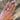 Hand wearing a radiant ab grown diamond 